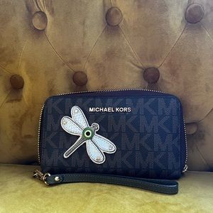NEVER USED. 

Saffiano leather w MK signature polyester fabric lining